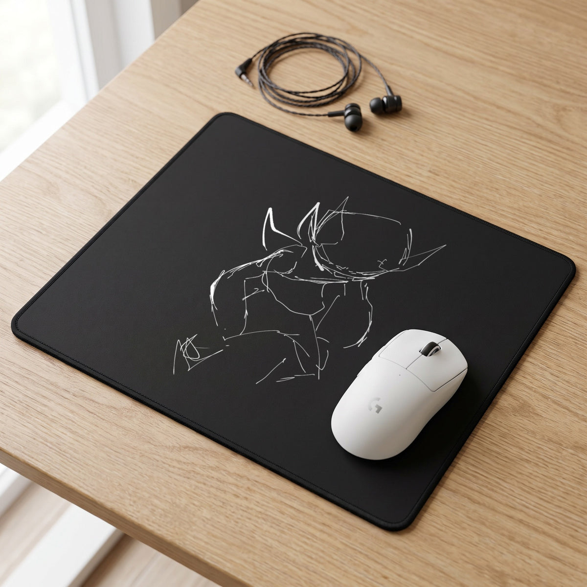 Sketch Series 006 Black Mini mouse pad on a desk with a wireless mouse and IEMs